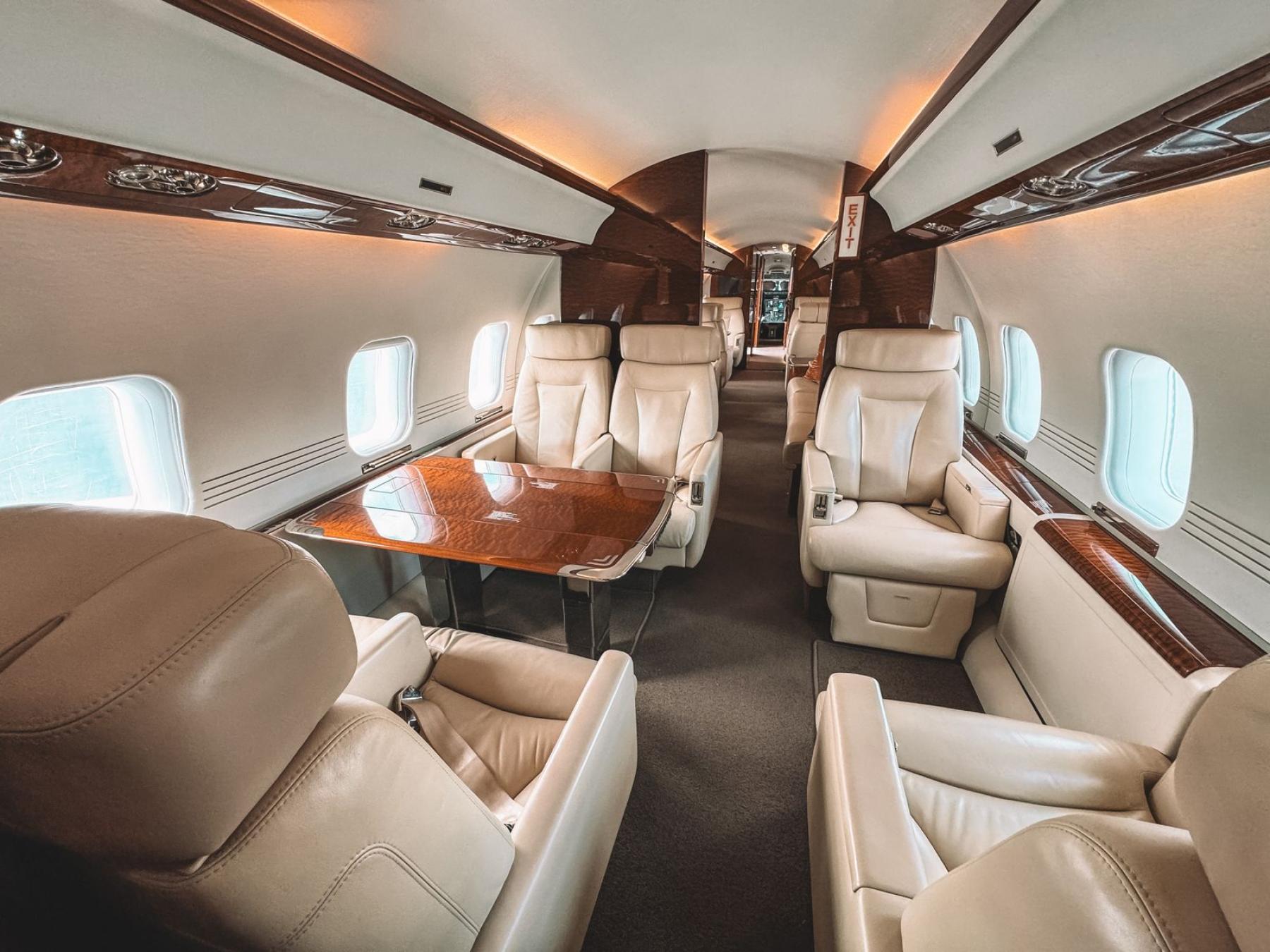 Private jet cabin with leather seating