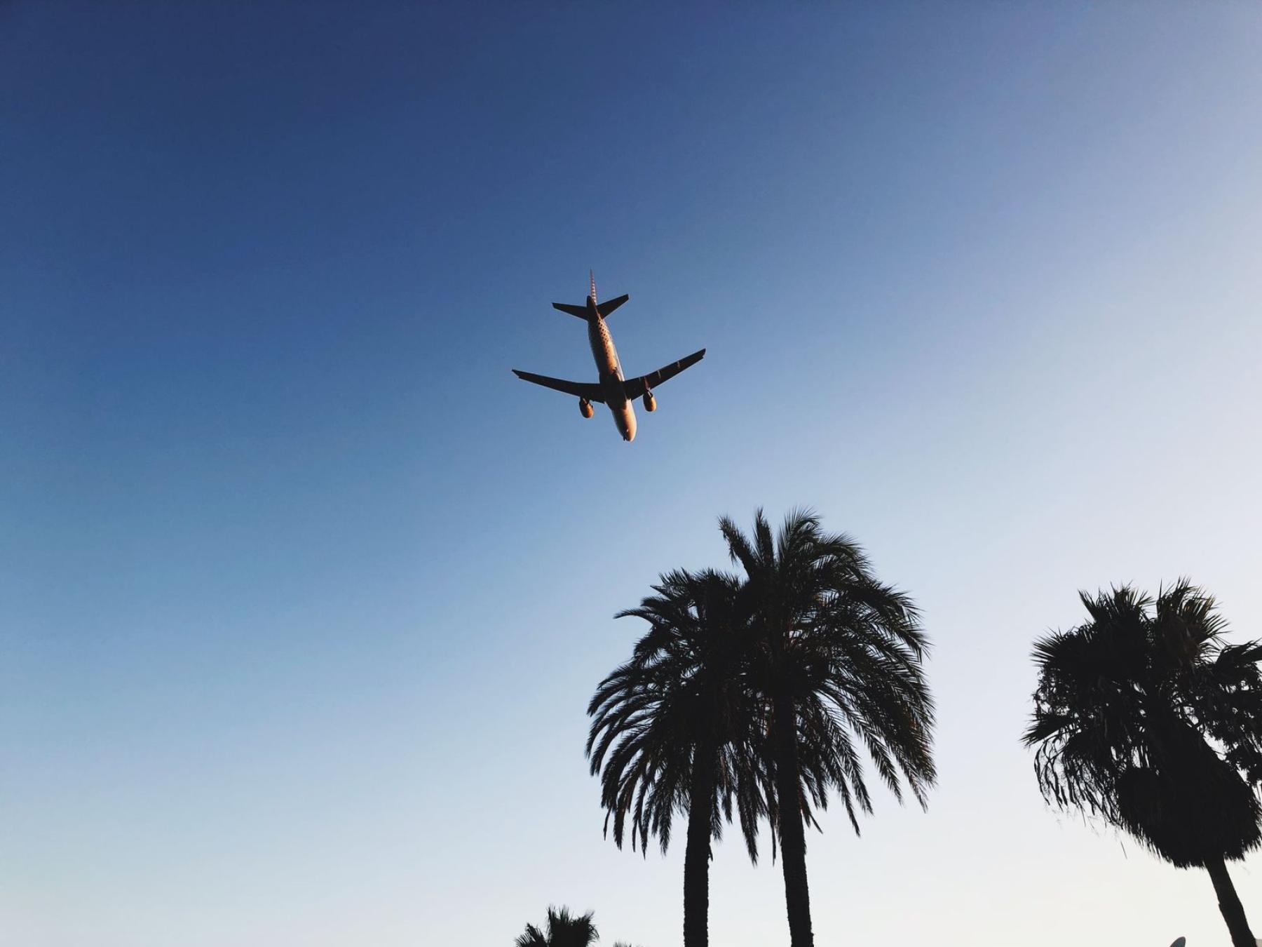 An aircraft small against an open sky