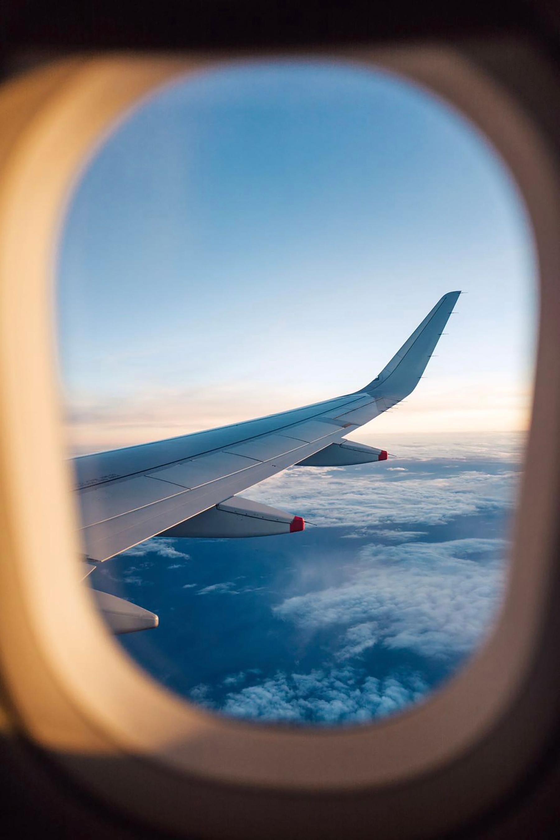 Wing seen from a cabin window in warm light